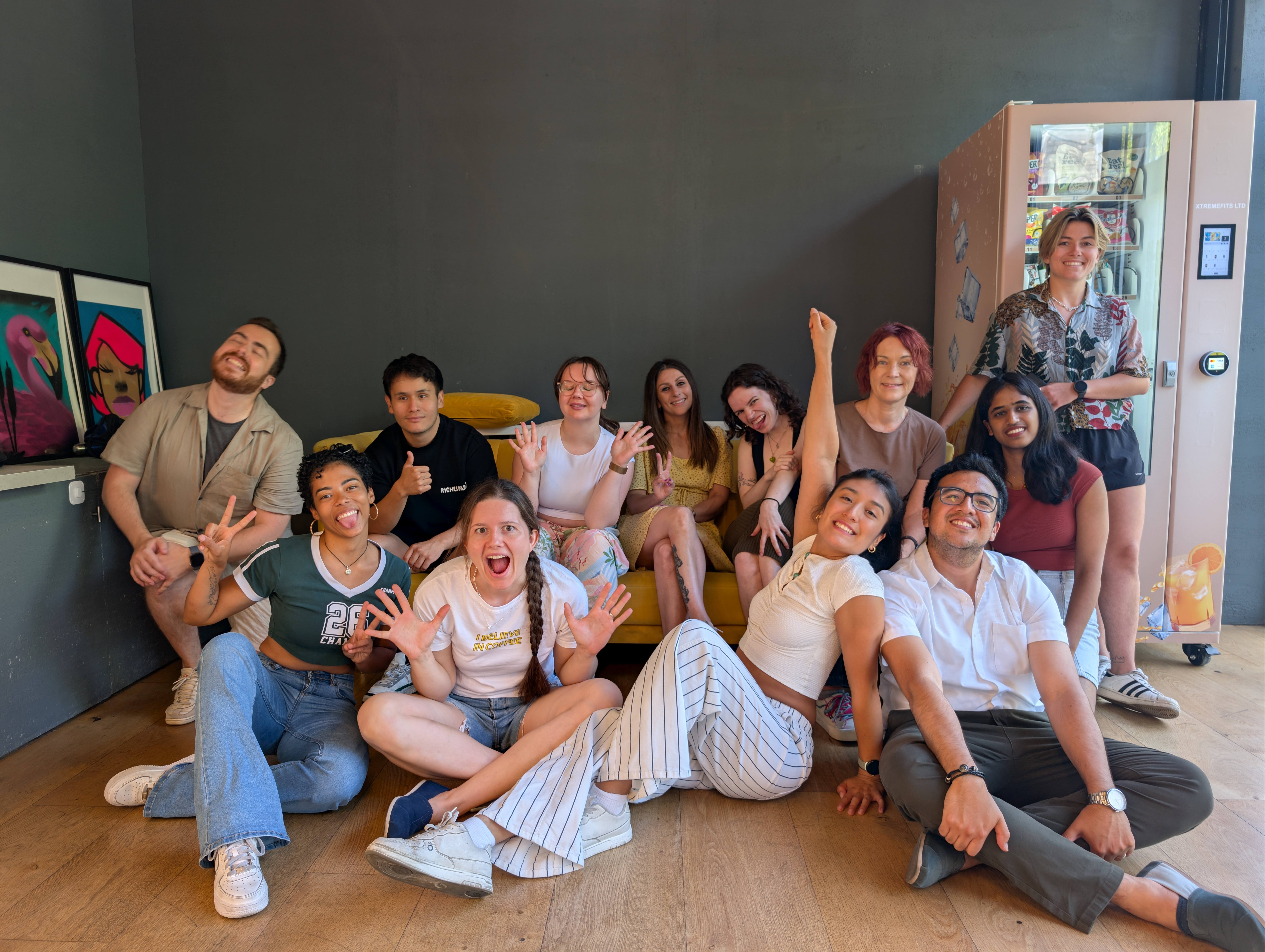 A group of Dominican Touch dancers smiling together indoors